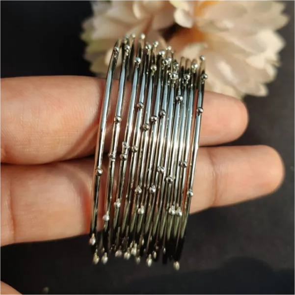 Silver steel doted bangles set